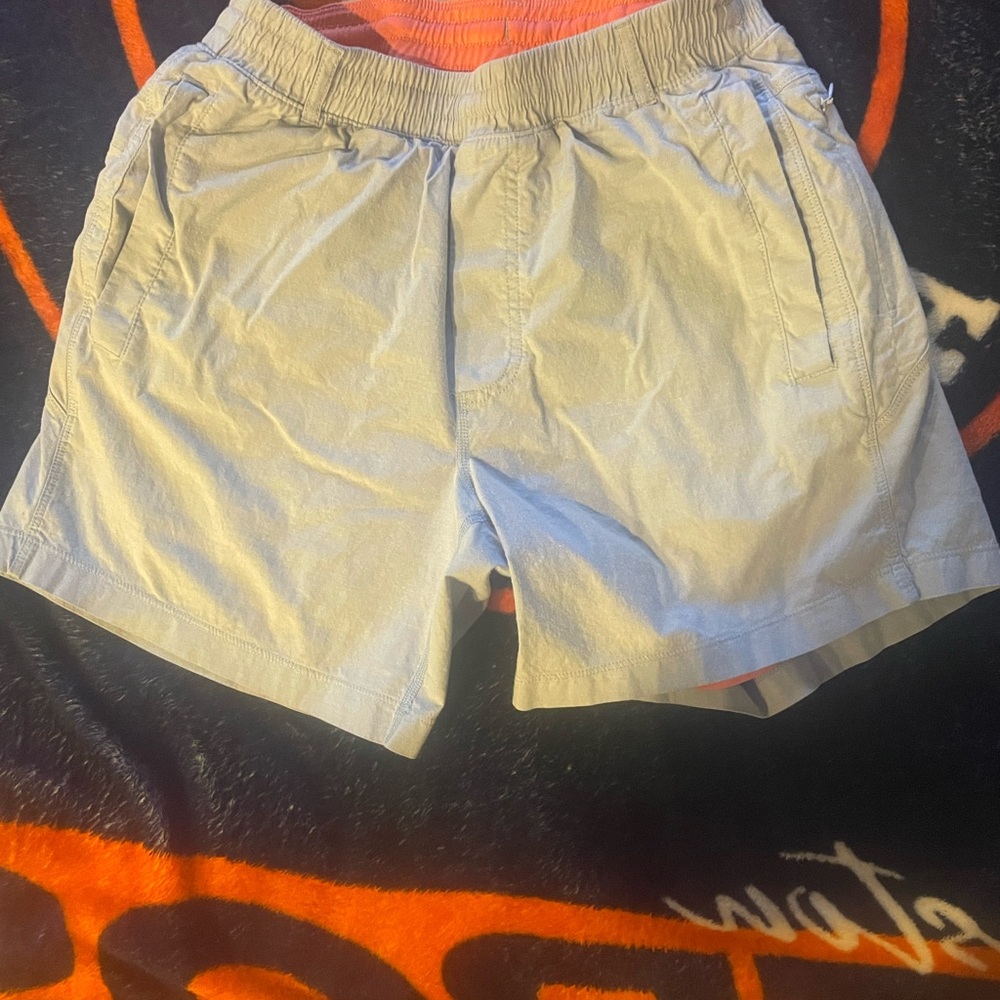 Light Gray Athletic Shorts with Elastic Waistband and Reflective Material